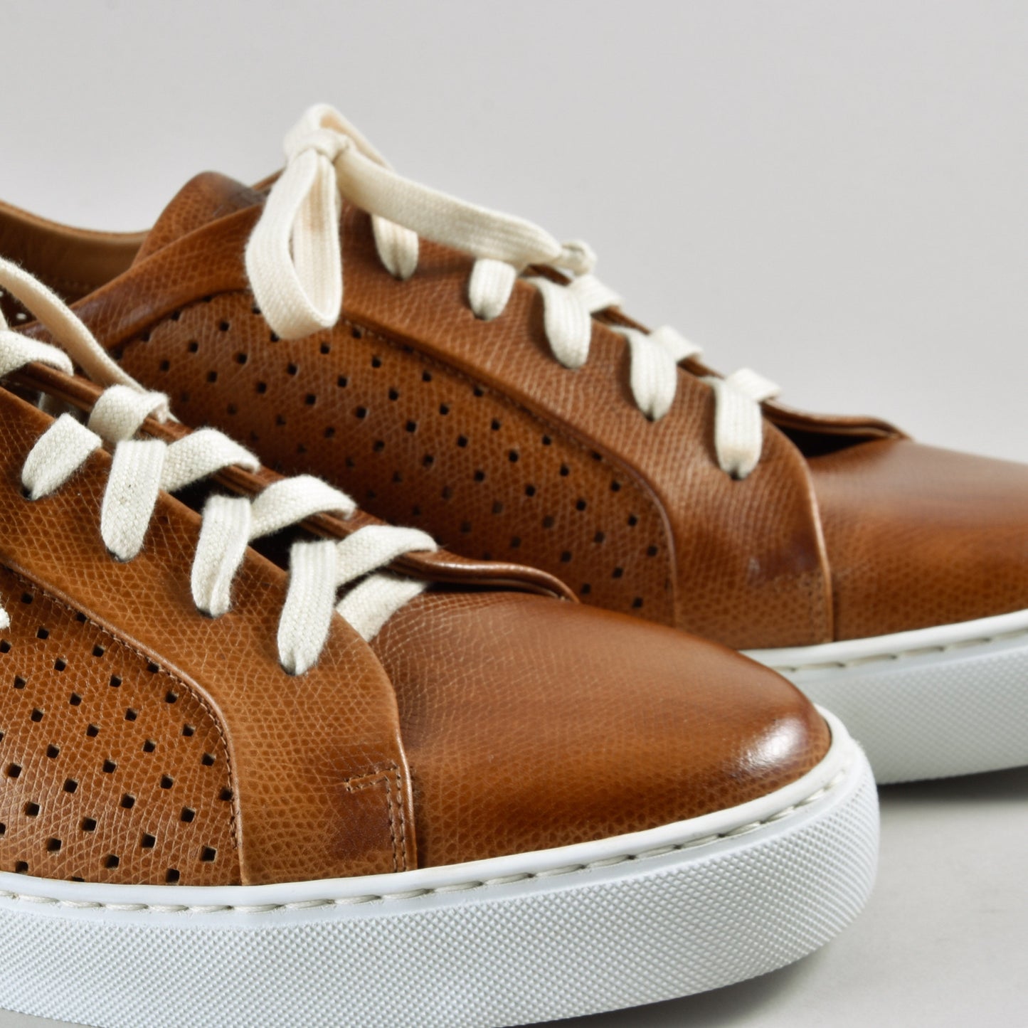 Sneakers in perforated leather